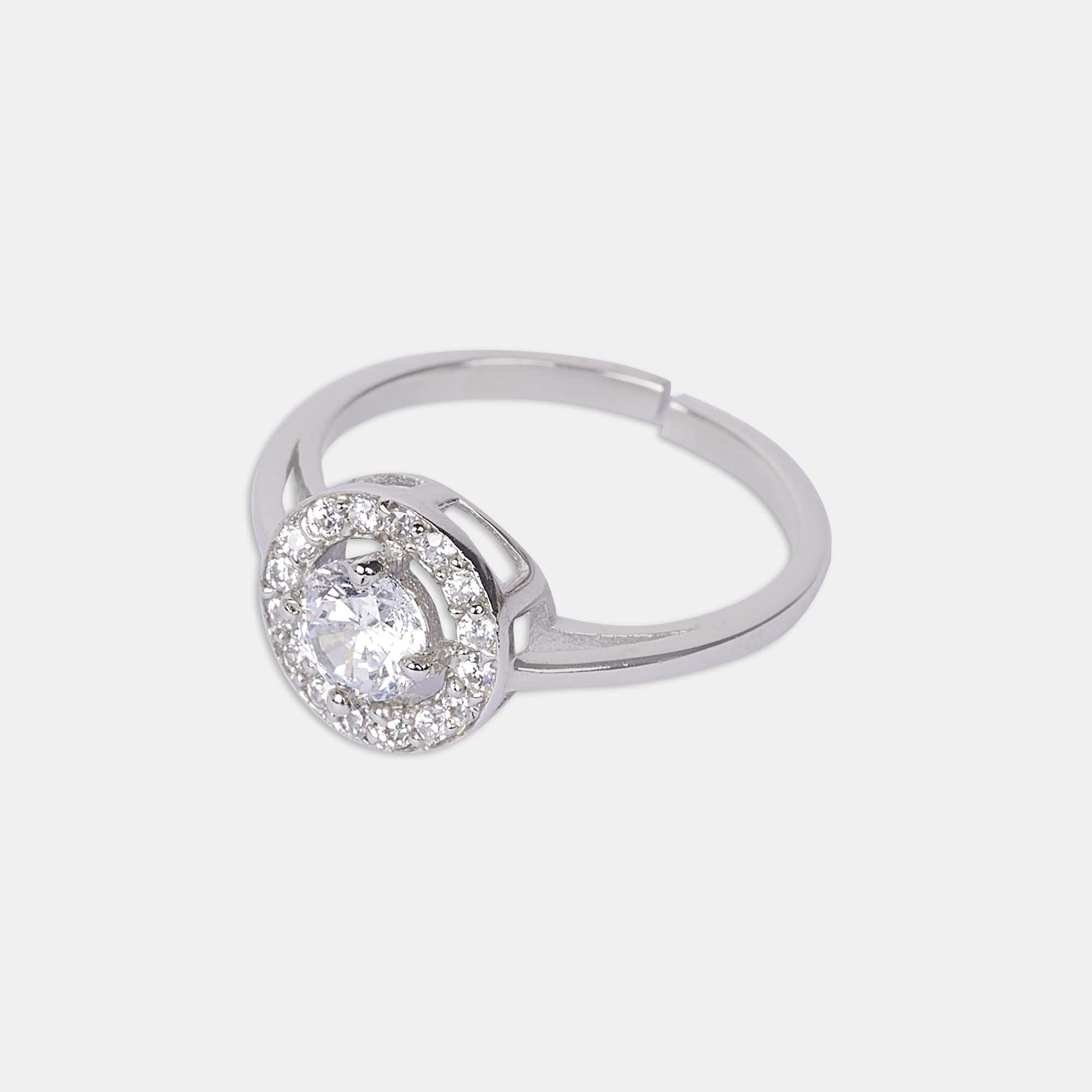 Experience the enchantment of a sterling silver ring, gleaming against a flawless white canvas, emanating everlasting charm.