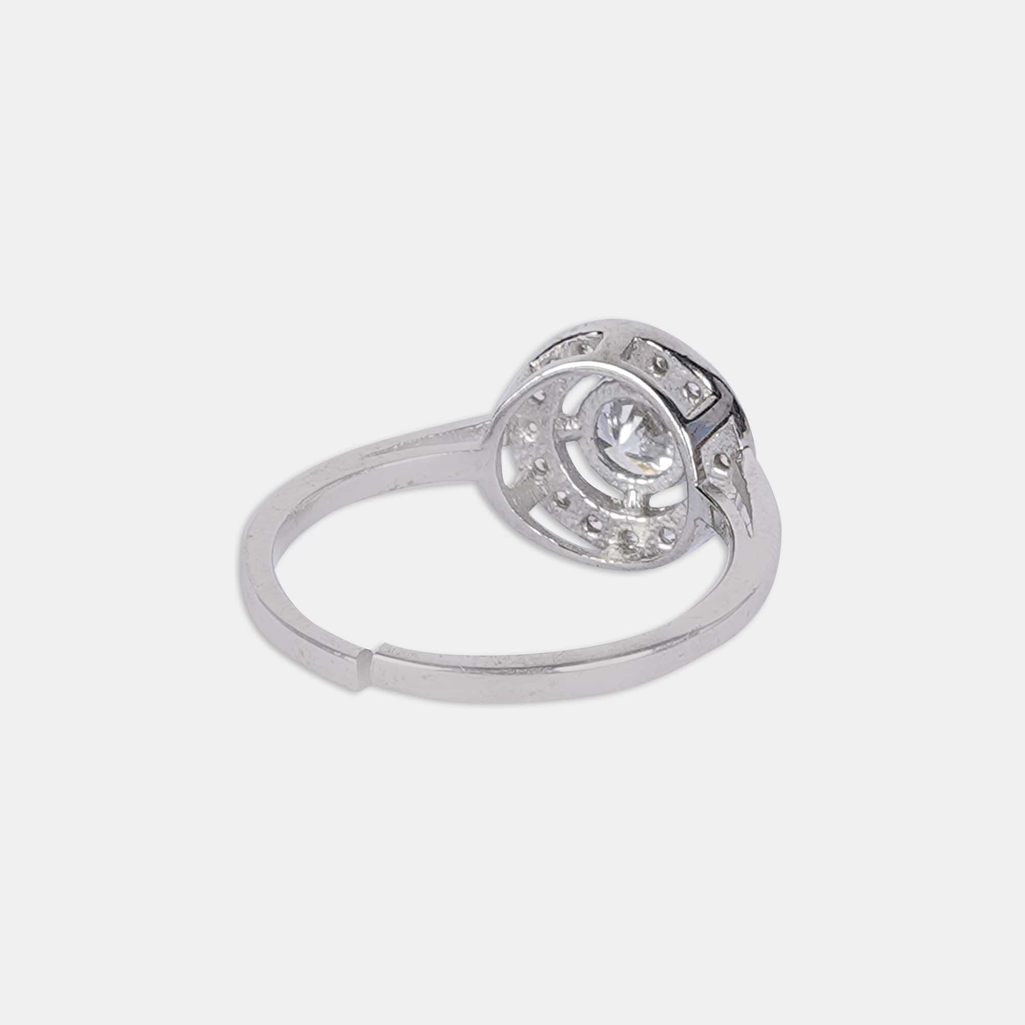 Experience the enchantment of a sterling silver ring, gleaming against a flawless white canvas, emanating everlasting charm.