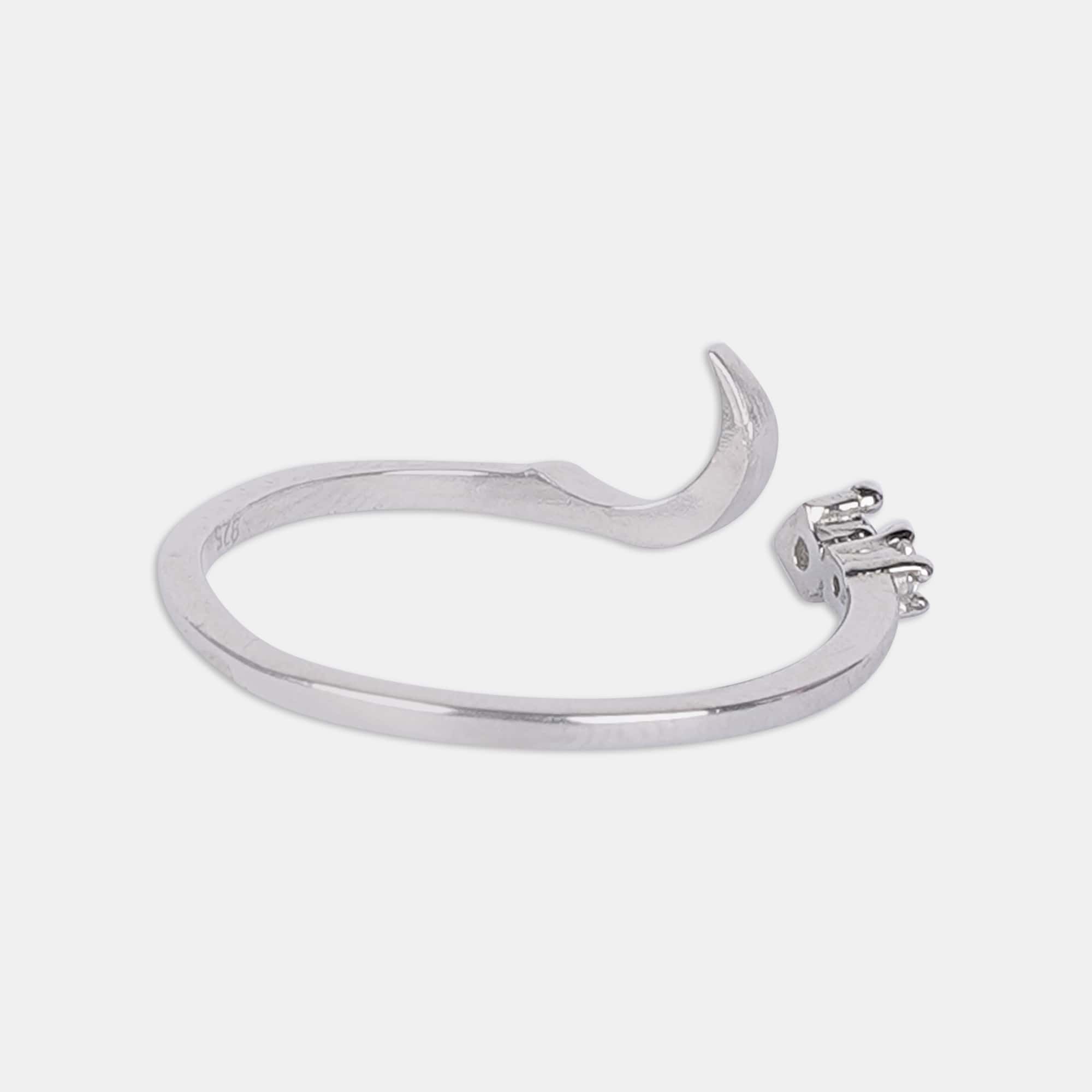 A sterling silver ring featuring a delicate crescent and star design