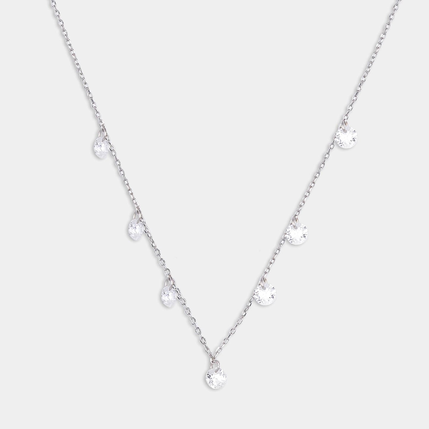 A dazzling sterling silver necklace adorned with delicate white stones, adding a touch of elegance to any outfit.