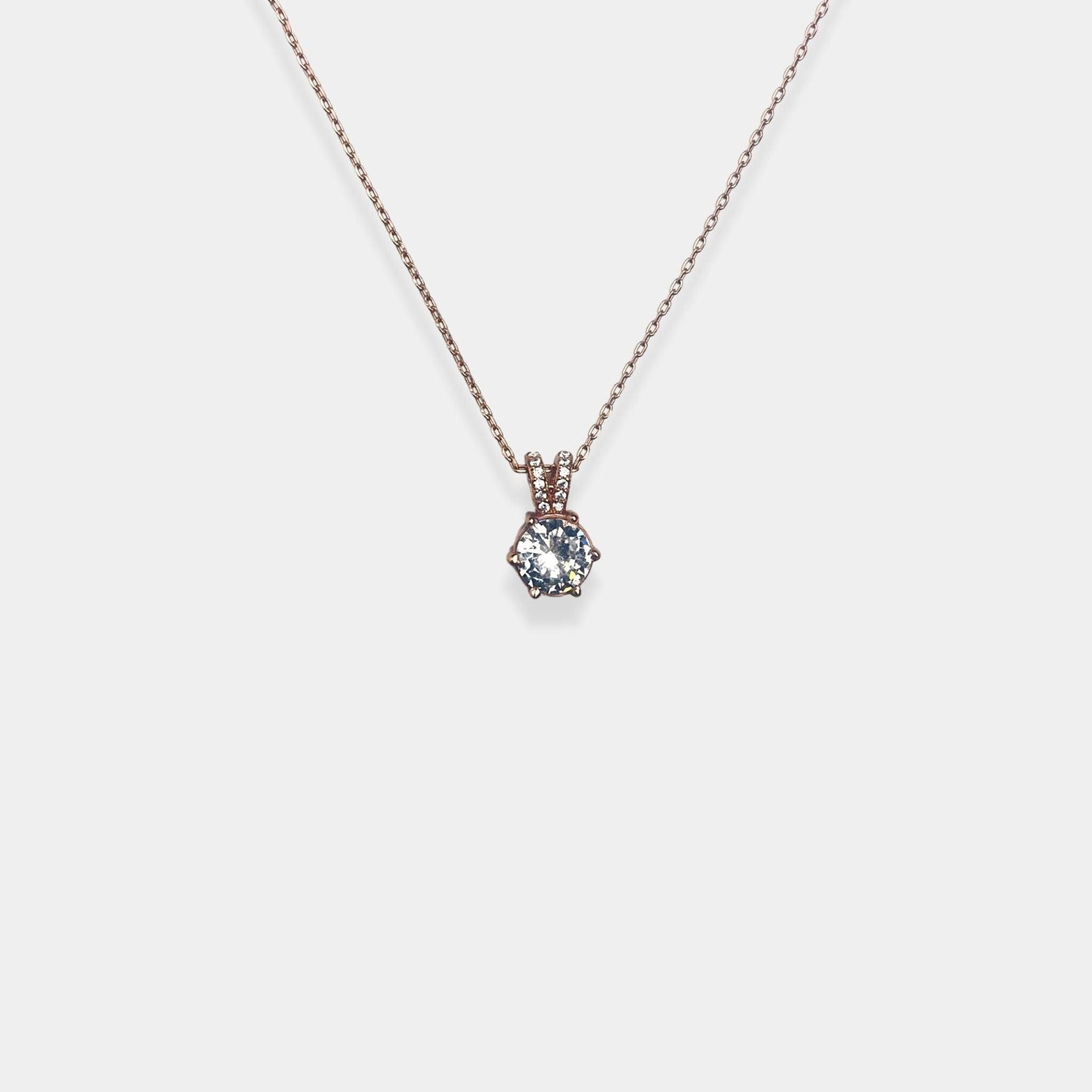 Elevate your style with our exquisite sterling silver necklace featuring a gracefully hanging sparkling silver pendant.