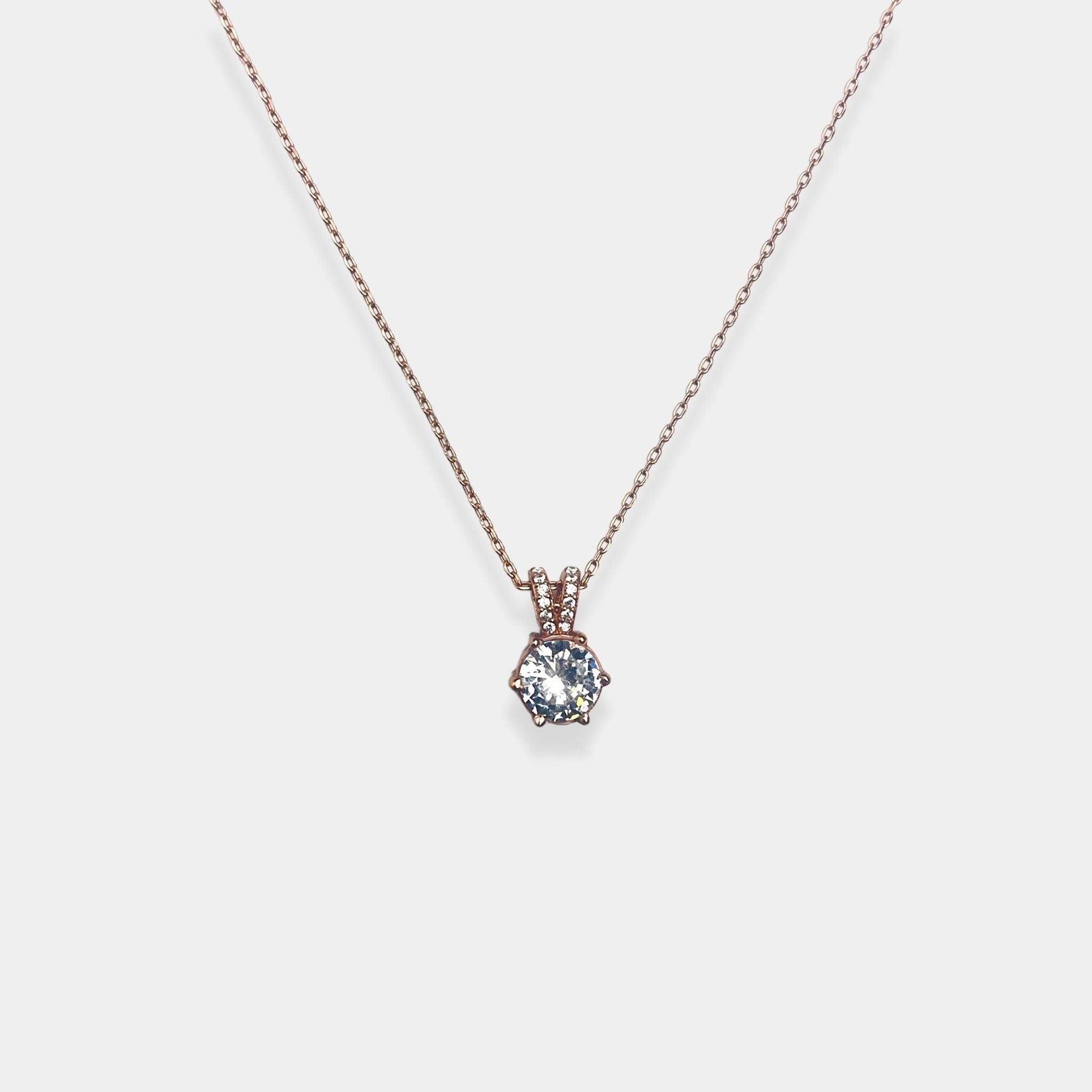 Elevate your style with our exquisite sterling silver necklace featuring a gracefully hanging sparkling silver pendant.