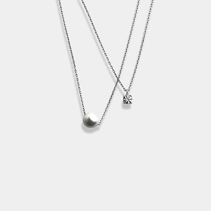 Elevate your style with our exquisite sterling silver necklace featuring a captivating circle pendant on a beautifully layered delicate chain.
