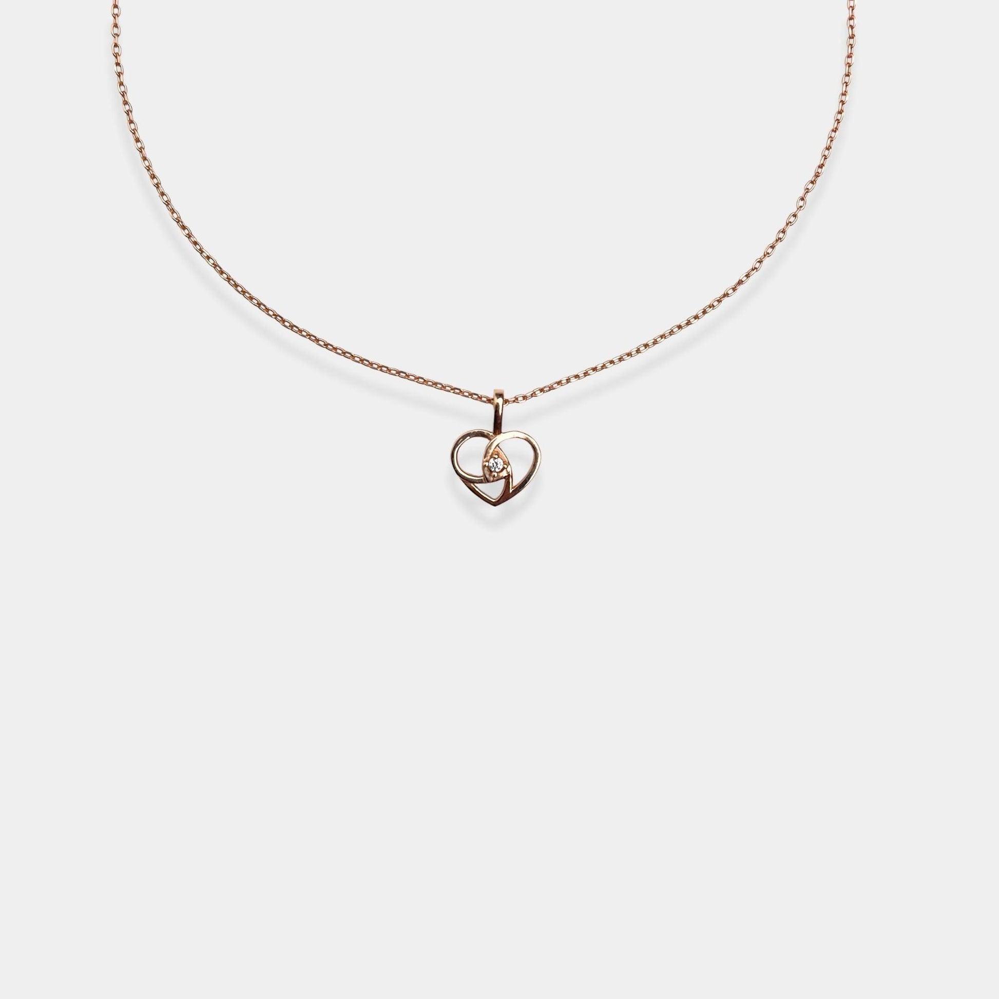 Fall in love with our stunning rose gold Love's Embrace Necklace, a timeless expression of affection