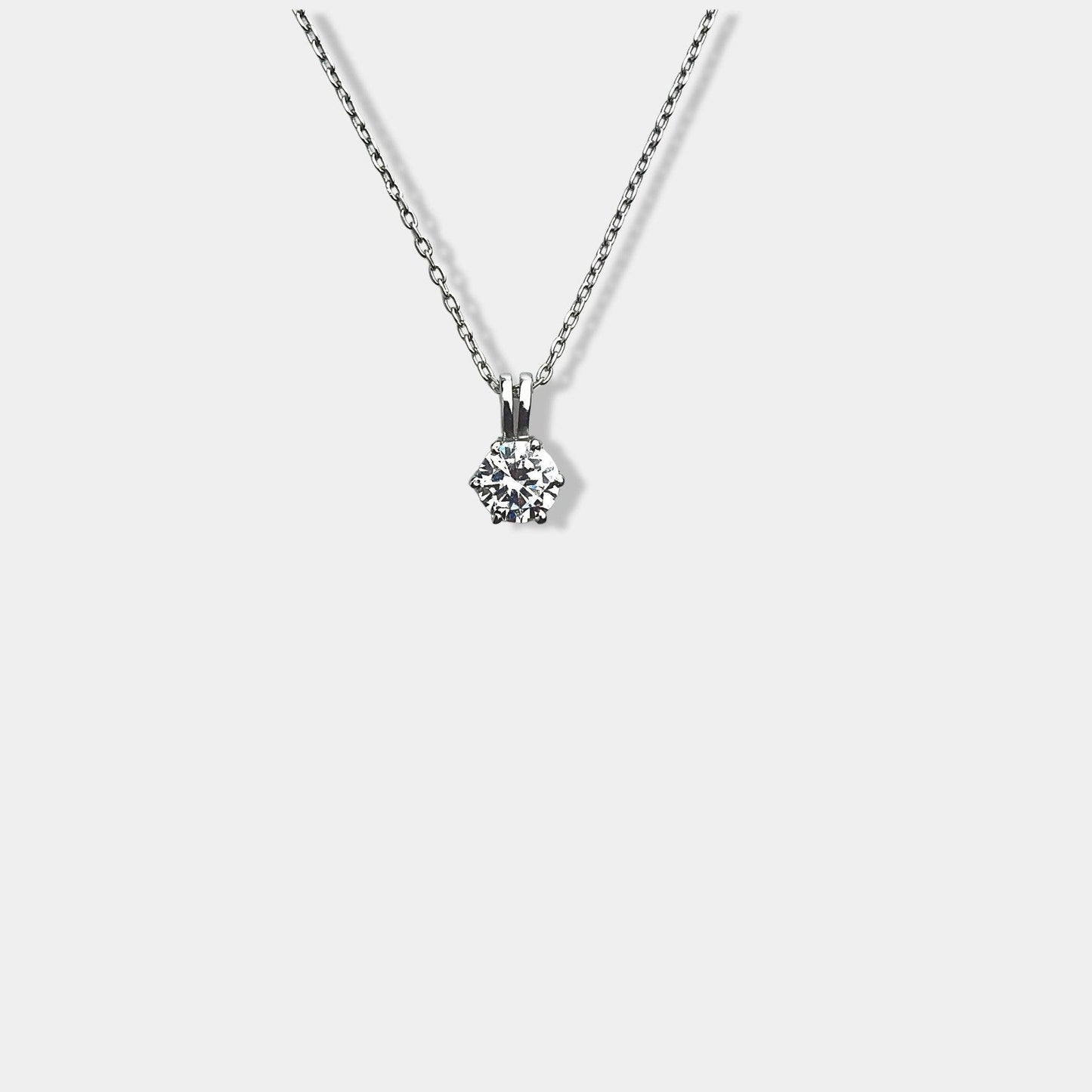 Enhance your style with a dazzling pendant on a chic sterling silver necklace. 2. Elevate your fashion game with a stunning pendant and a stylish sterling silver necklace. 3. Add a touch of elegance to your outfit with a shimmering pendant on a sleek sterling silver necklace.