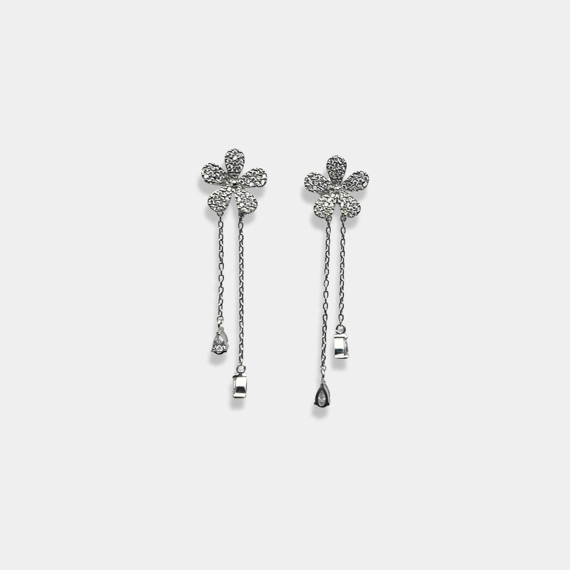 Sterling silver earrings with a beautiful flower pattern, perfect for adding a touch of elegance to any outfit.