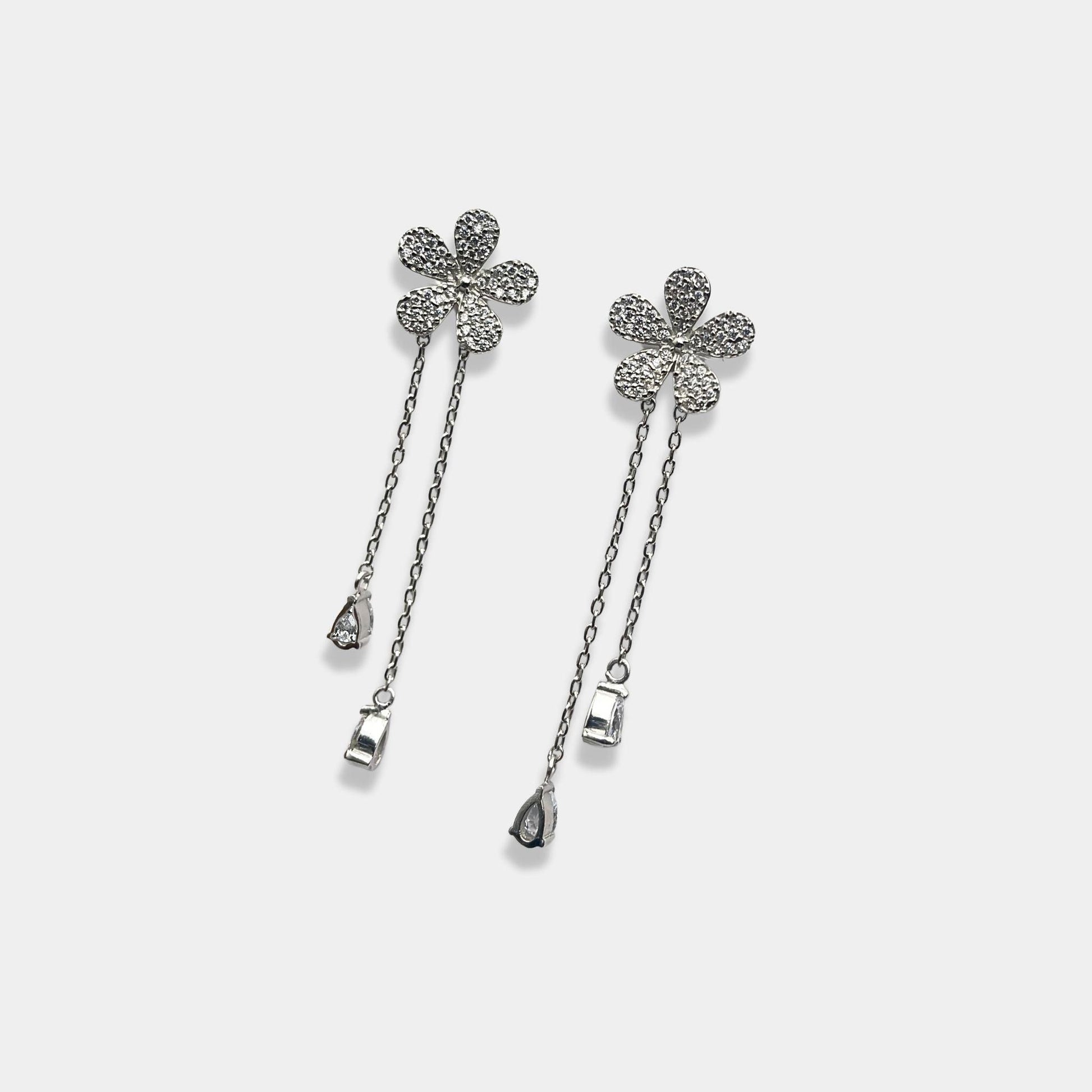 Sterling silver earrings with a beautiful flower pattern, perfect for adding a touch of elegance to any outfit.